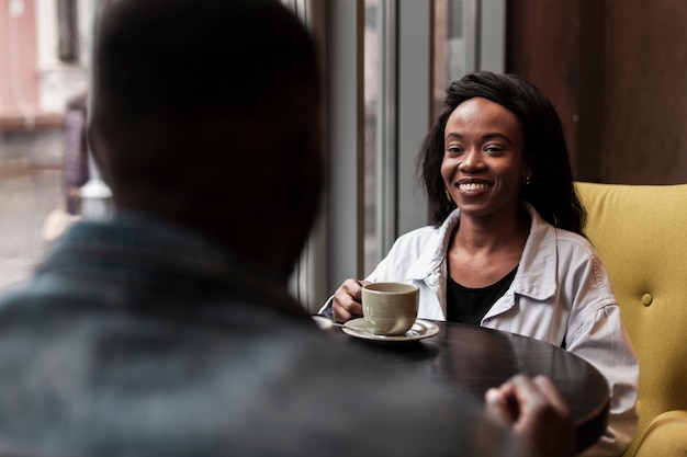 Happy female looking at man