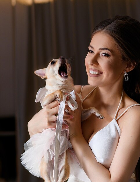 Happy fiancee holding cute pet