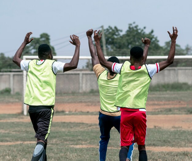 Happy football players after match