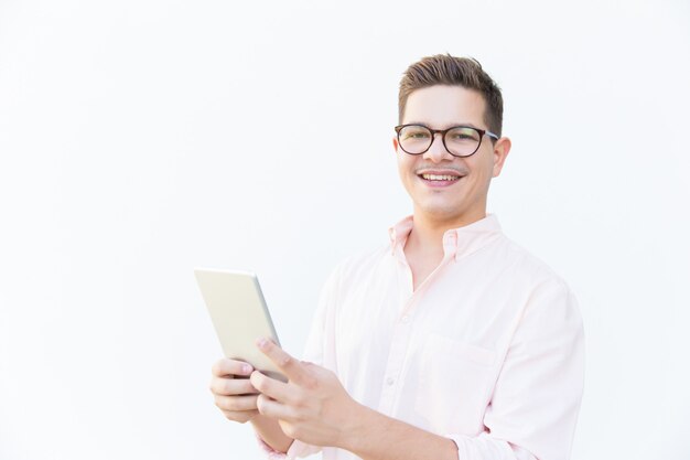 Happy friendly app developer posing with tablet