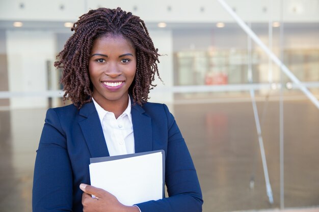 Happy friendly legal expert posing outside