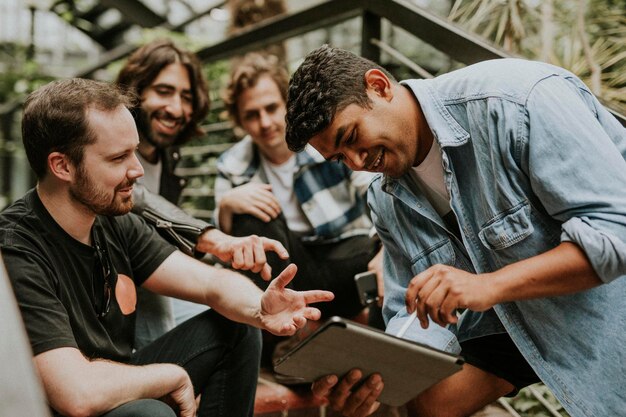 Happy friends chatting together, stock image in botanical garden