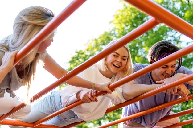 Happy friends laughing outdoors