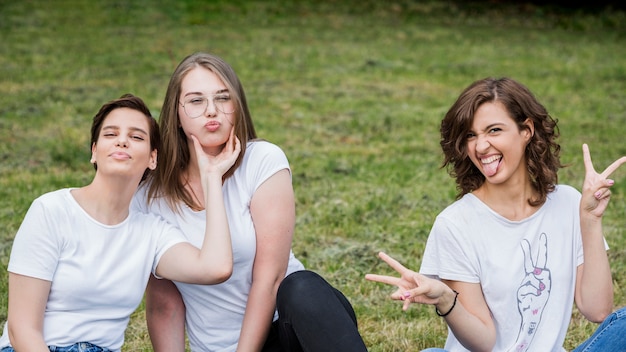 Free photo happy friends making faces at camera