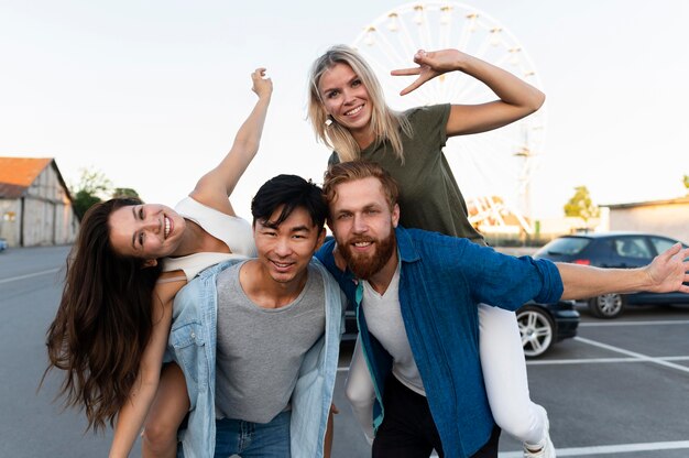 Happy friends posing on street