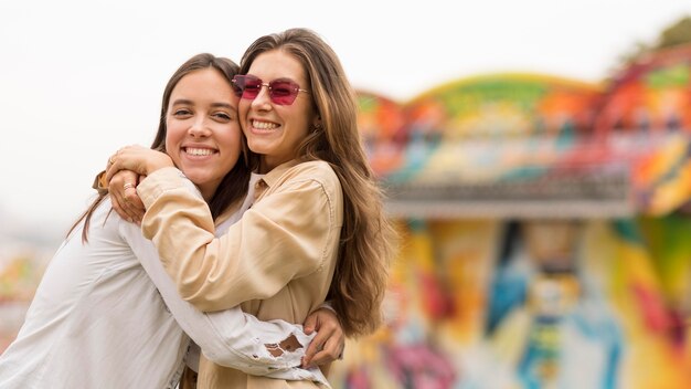 Happy friends posing together outdoors