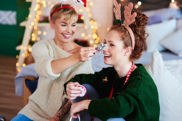 Happy friends preparing christmas presents for Christmas