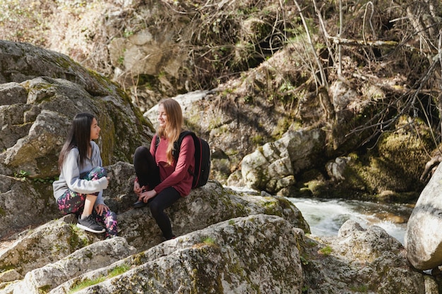 Free photo happy friends resting outdoors