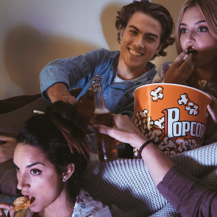 Free Photo happy friends watching a movie