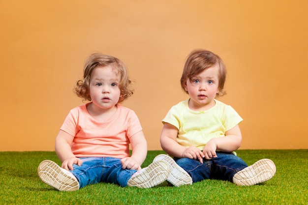 Free photo happy funny girl twins sisters playing and laughing