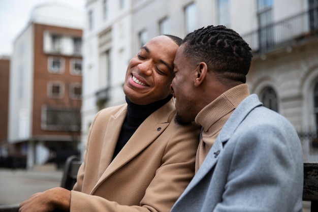 Free photo happy gay couple out on a date in the city