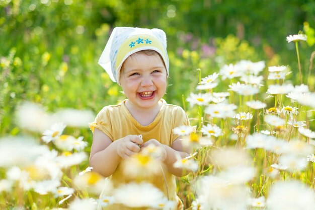 happy girl in daisy meadow