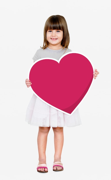 Happy girl holding a heart icon