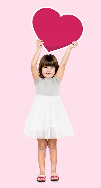 Happy girl holding a heart icon