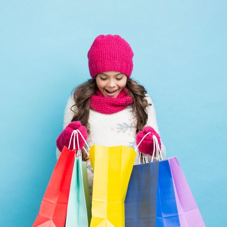 Free Photo happy girl looking in shopping bags