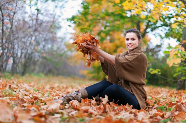 Happy girl throws maples