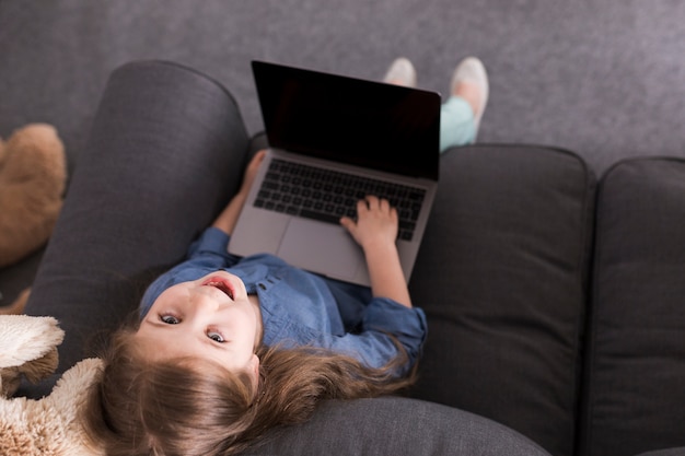 Happy girl using laptop