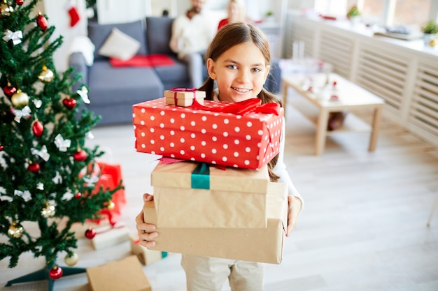 Free photo happy girl with christmas presents