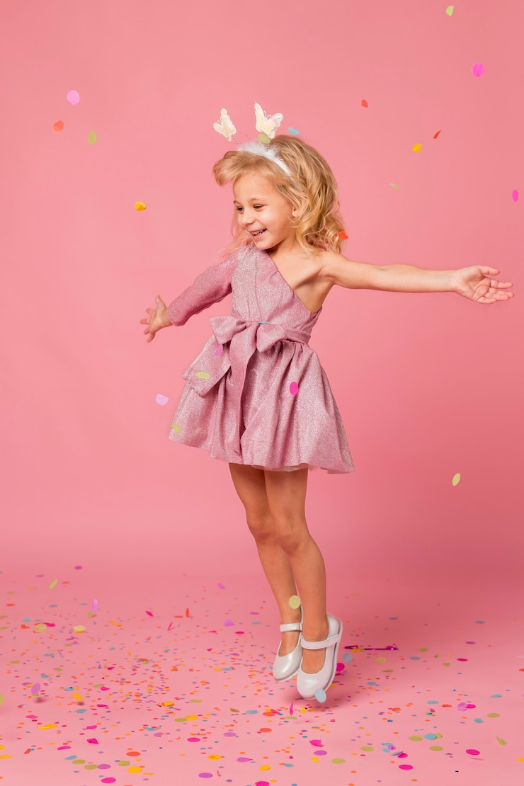 Free Photo happy girl with fairy costume and confetti
