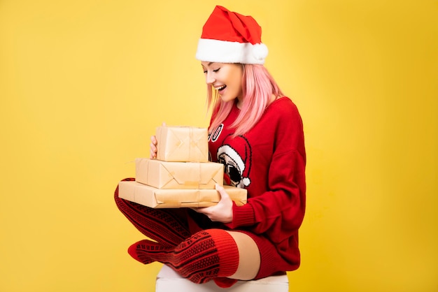 Free photo happy girl with gifts in hands