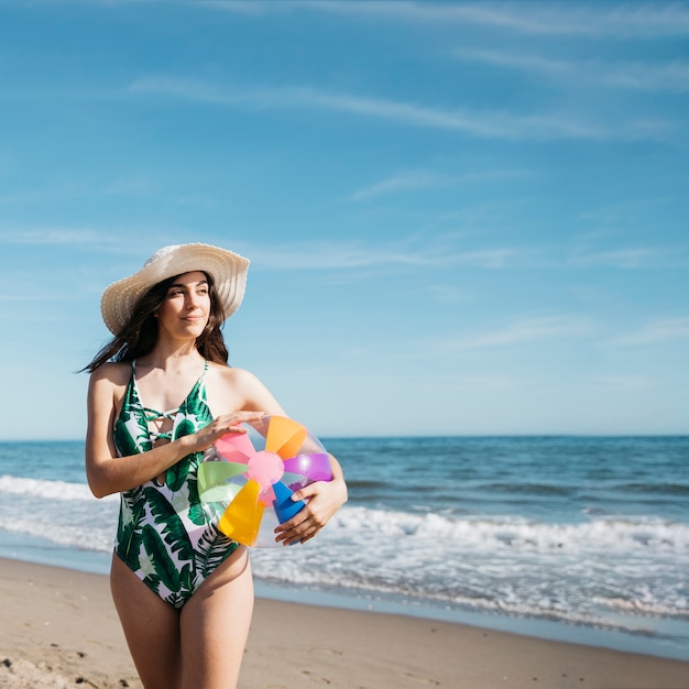 Free photo happy girl with inflatable ball