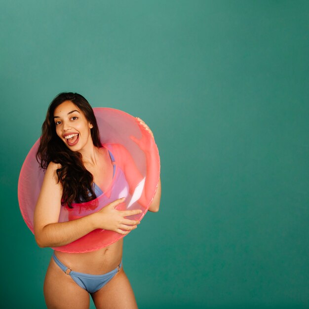 Happy girl with inflatable ring