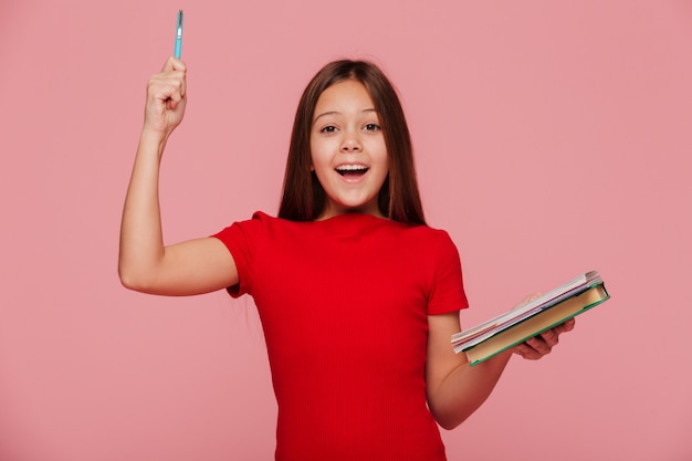 Free photo happy girl with pencil and books have and idea an smiling isolated