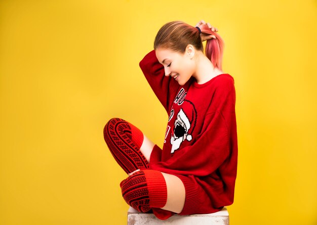 Happy girl with winter red suit