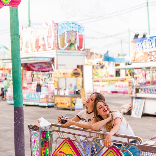 Happy girls having fun in the amusement park