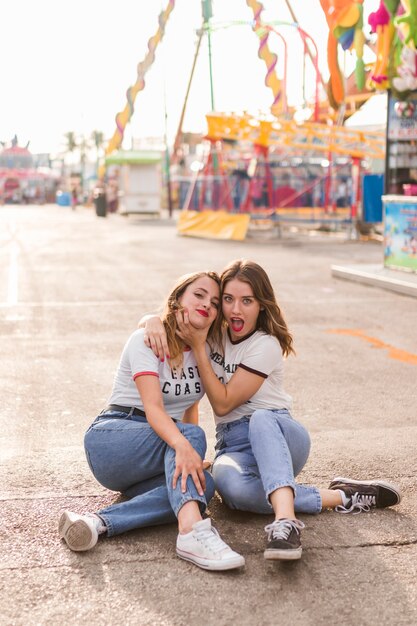 Happy girls having fun in the amusement park