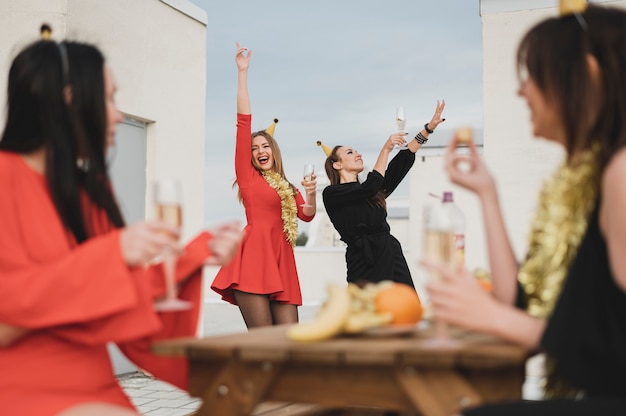 Happy girls partying on the rooftop