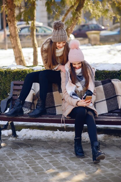 Happy girls in a winter city