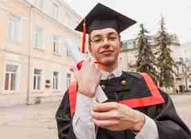 Free photo happy graduated student with diploma