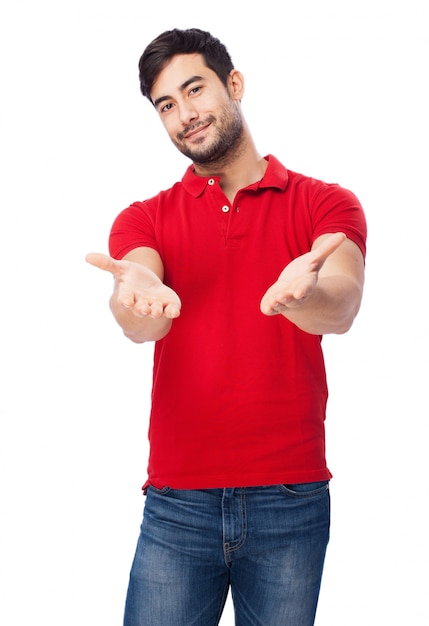 Happy guy with open hands on white background