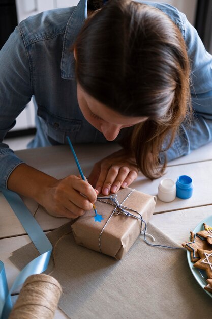 Free photo happy hanukkah holiday woman making a gift