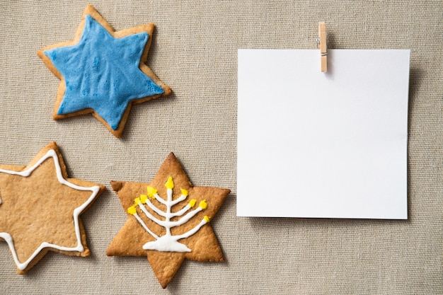 Happy hanukkah star of david cookies and copy space card