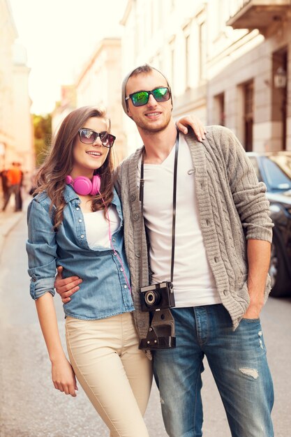 Happy hipster couple in city 
