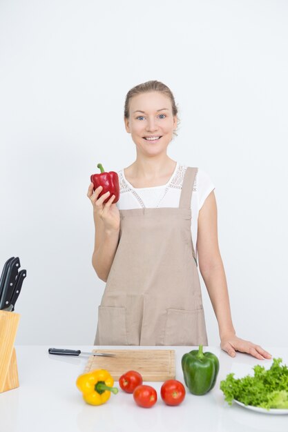 Happy housewife cooking tasty and healthy food