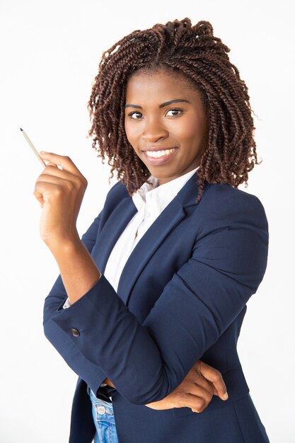 Happy joyful corporate coach holding pen