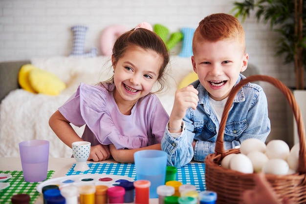 Happy kid over the colorful table