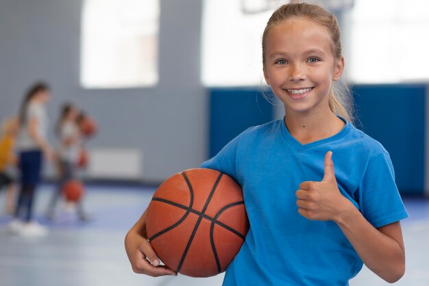 Happy kid enjoying her gym class