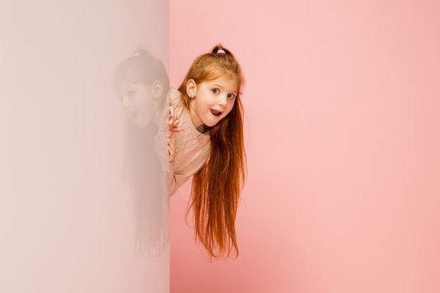 Free photo happy kid, girl isolated on coral pink