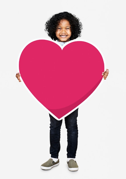 Happy kid holding a heart icon