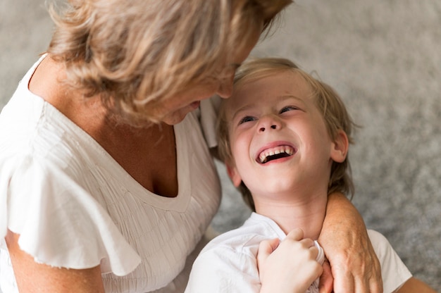 Happy kid looking at grandmother