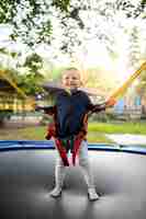 Free photo happy kid playing outdoors