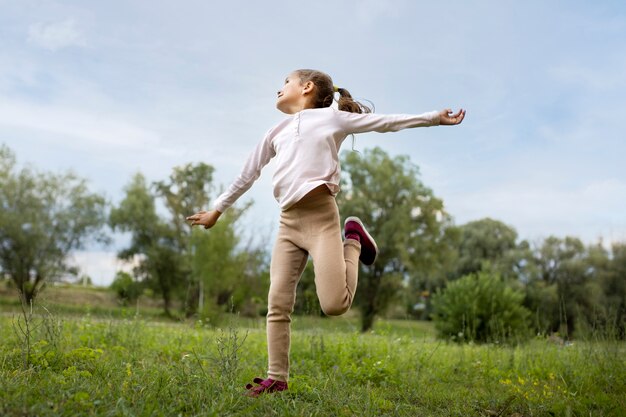 Happy kid playing outdoors