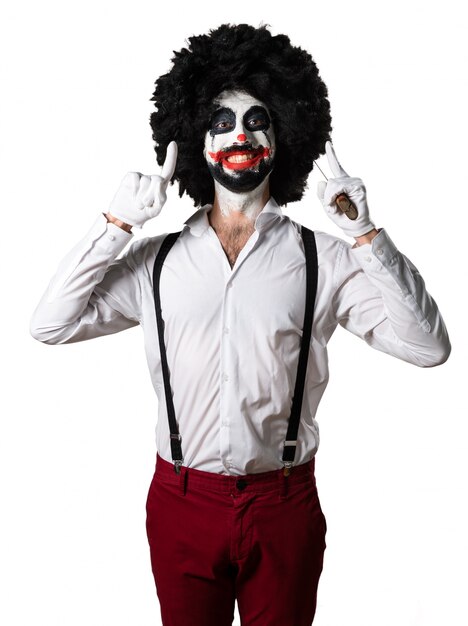 Happy killer clown with knife