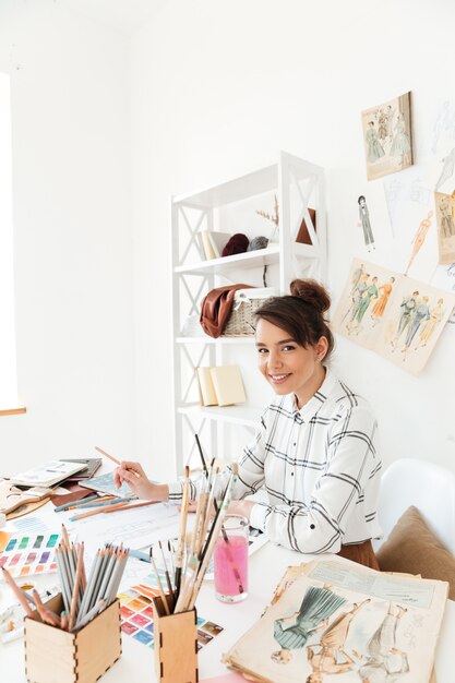 Happy lady fashion illustrator drawing