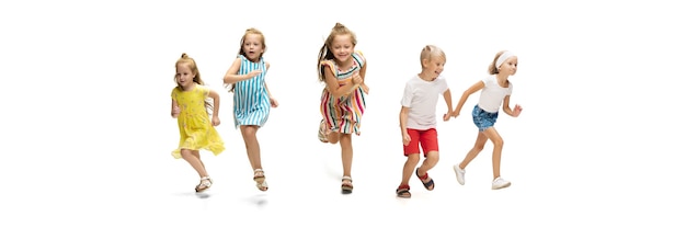 Happy little caucasian kids jumping and running isolated on white