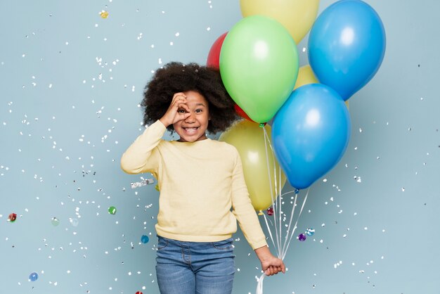 Happy little girl celebrating her birthday